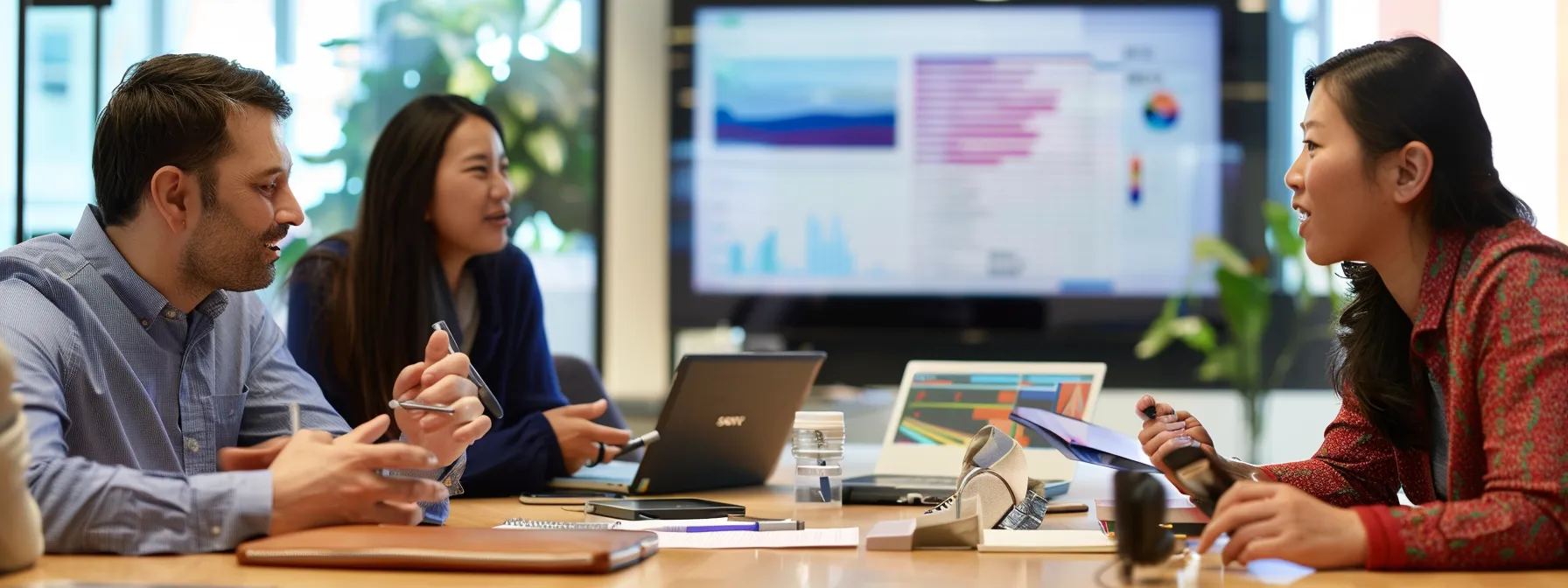 a team of professionals discussing search marketing strategies and data analysis tools in a modern office setting.