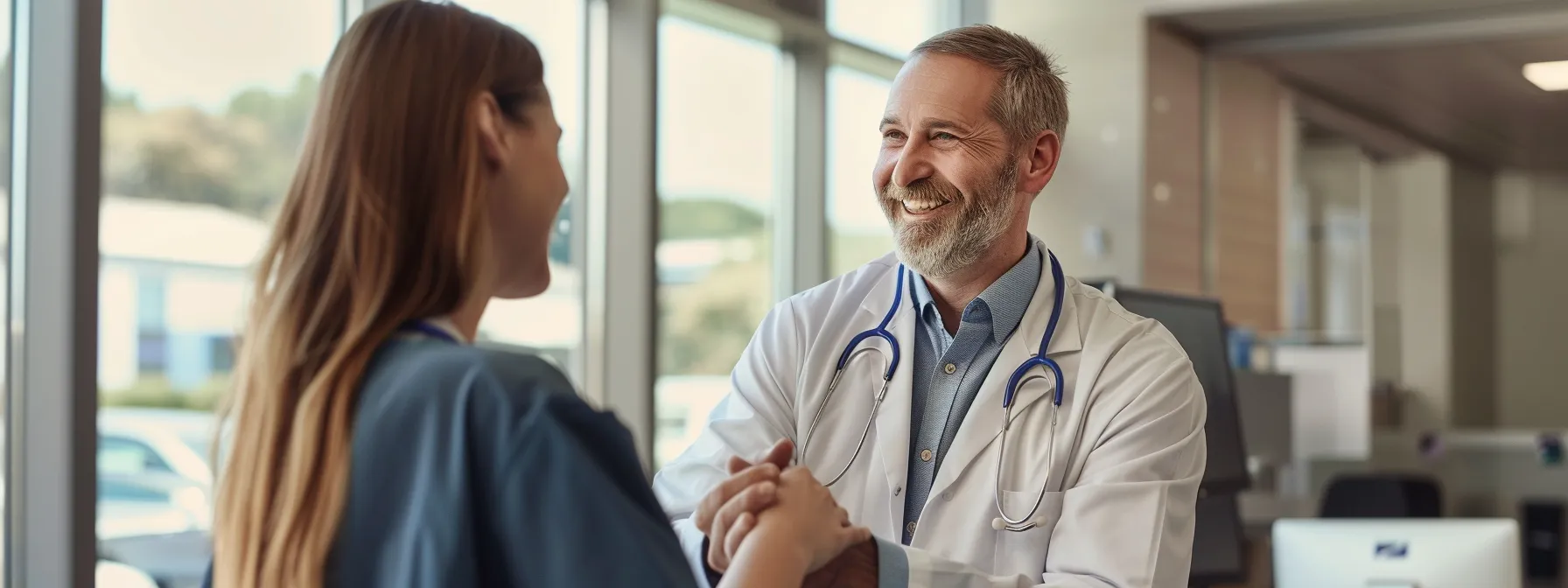 a patient smiling and shaking hands with a doctor in a modern, welcoming clinic setting.