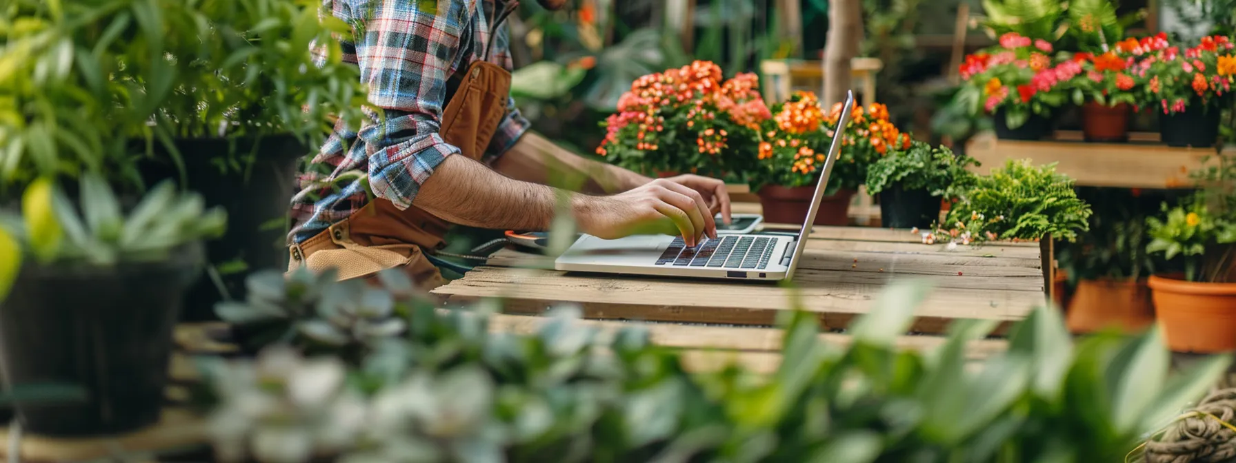 a landscaper working on a laptop, optimizing meta titles and descriptions for seo on their website.