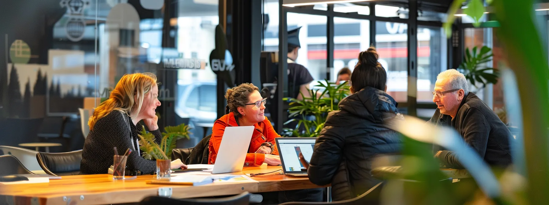 a group of professionals discussing seo strategy in a modern office setting in melbourne.