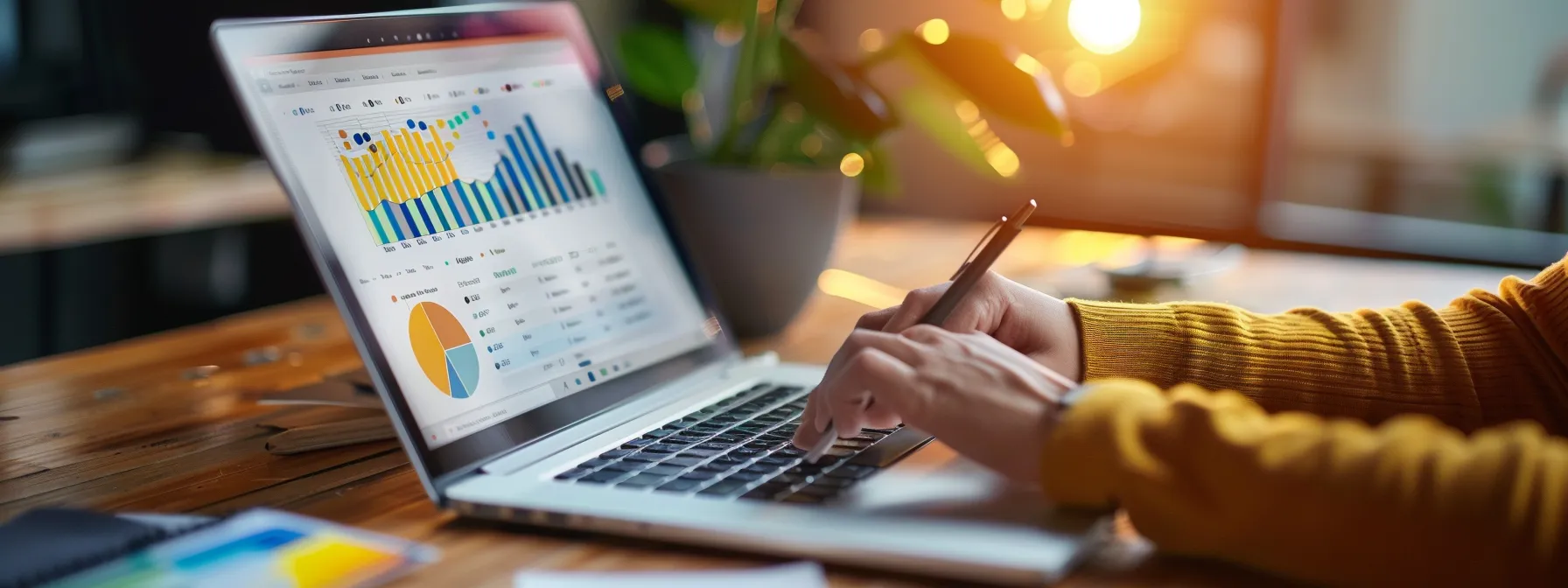 a person conducting keyword research on a laptop while surrounded by charts and graphs.