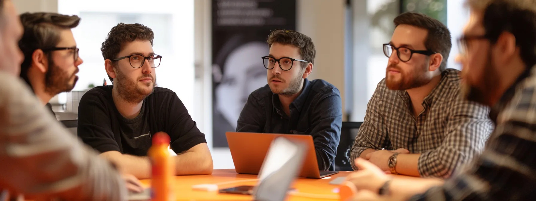 a team of web developers and seo experts discussing strategies for optimizing a hairdresser's website.