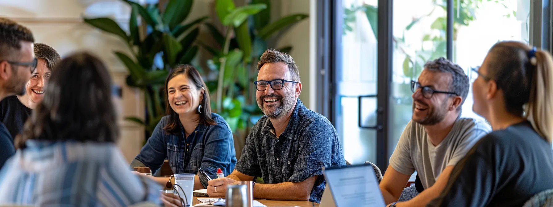 a group of people smiling and nodding in agreement during a positive marketing meeting in a cozy office setting in melbourne.